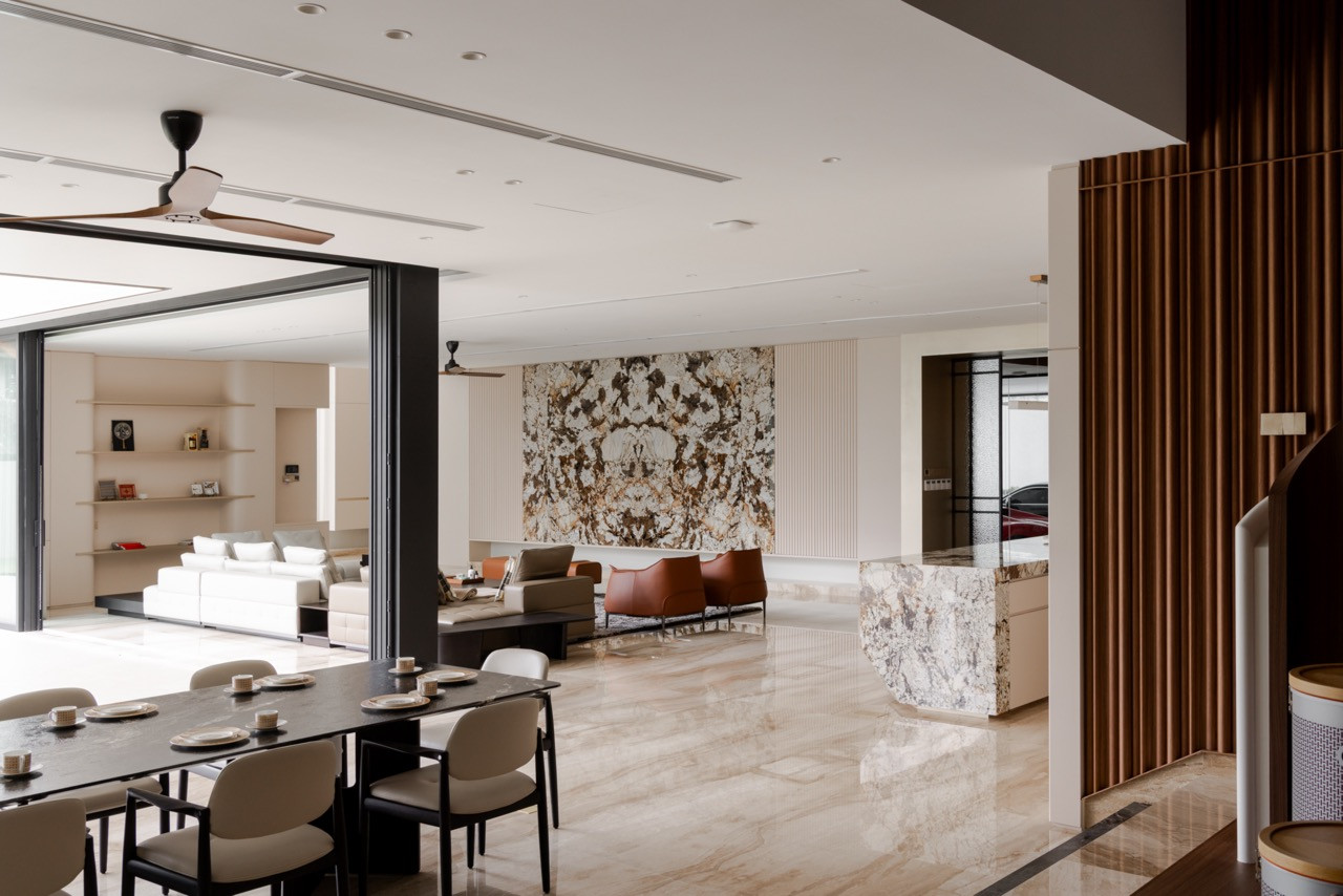 The main hall, showing the feature marble wall, timber slat detailing, stone bar counter