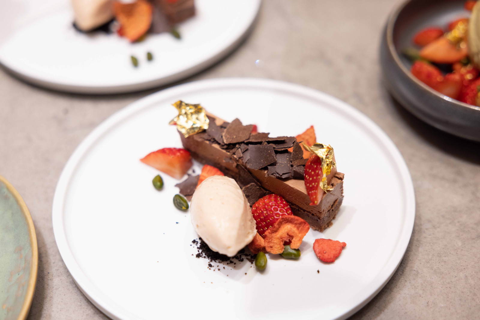 Dark chocolate torta with pistachio and strawberries