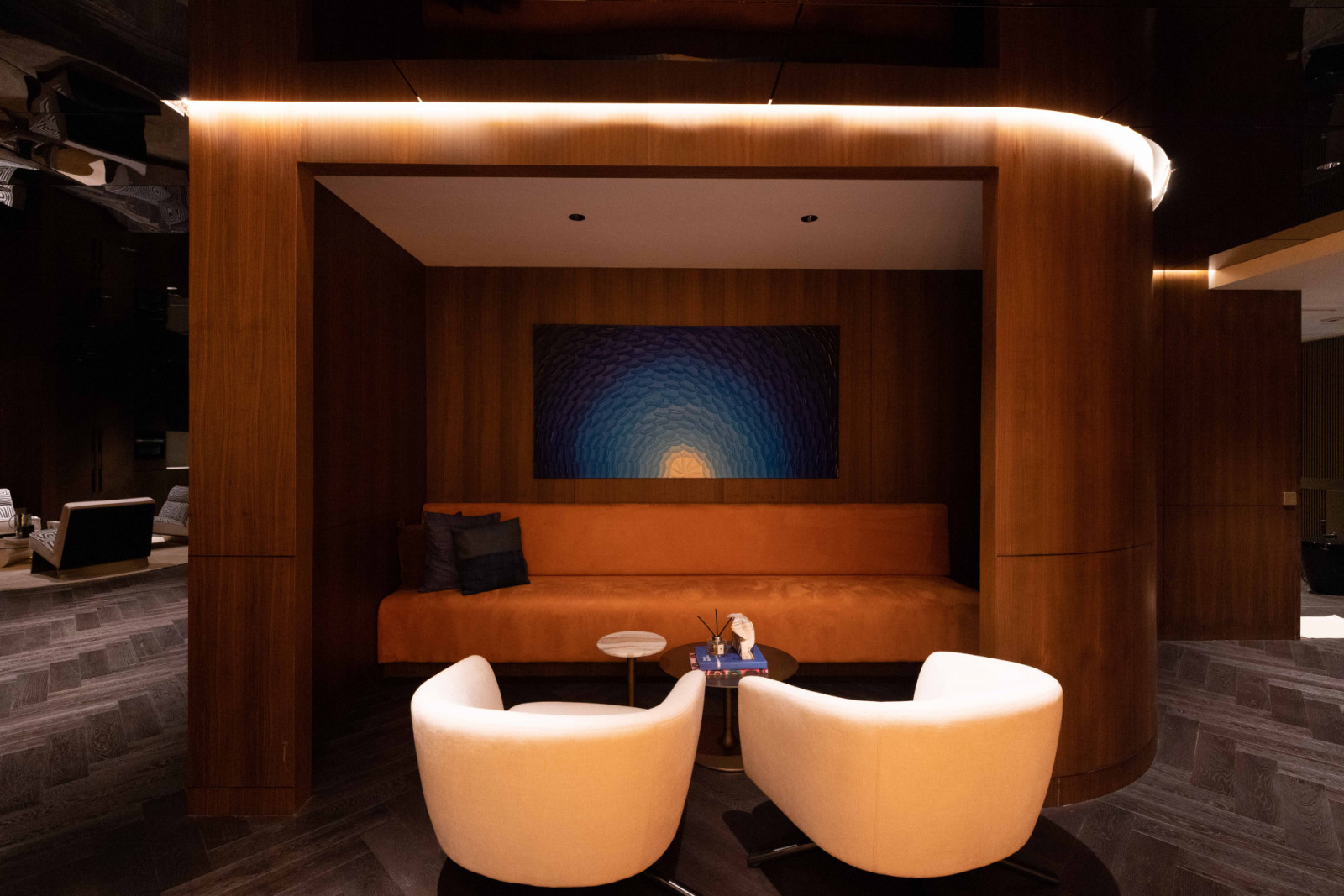 This seating area is brightened up with a textural painting