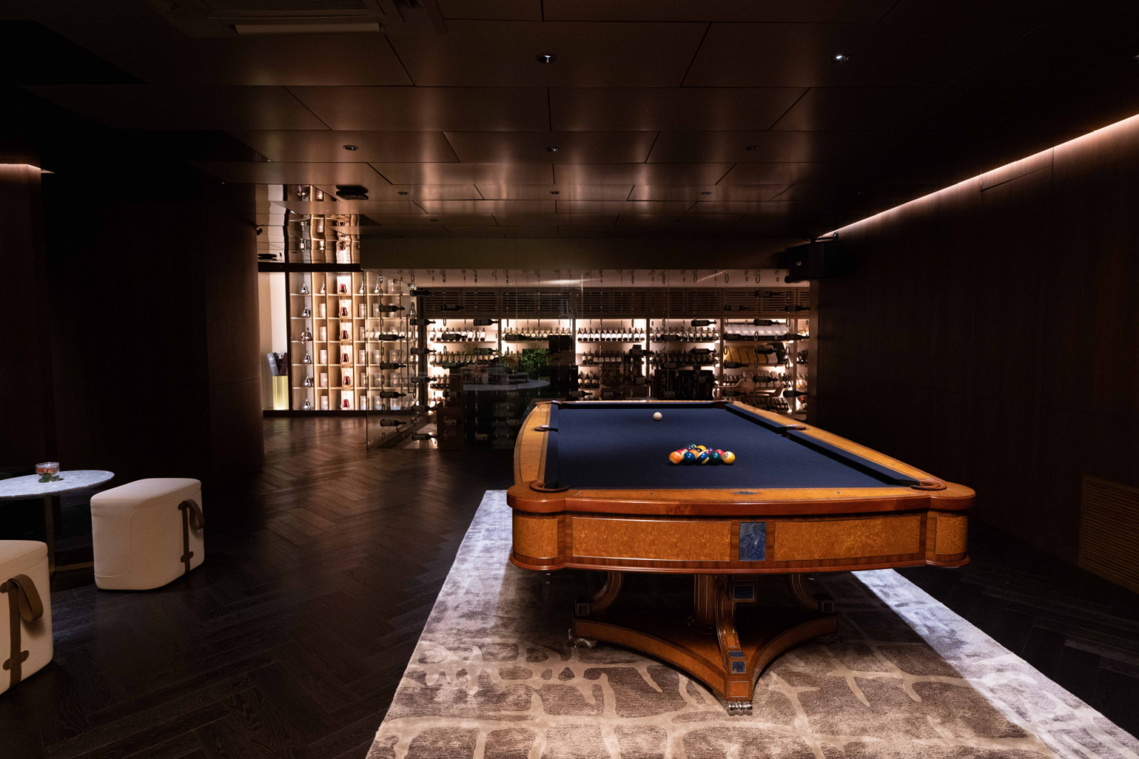 The entertainment space in the basement features a pool table and a karaoke area