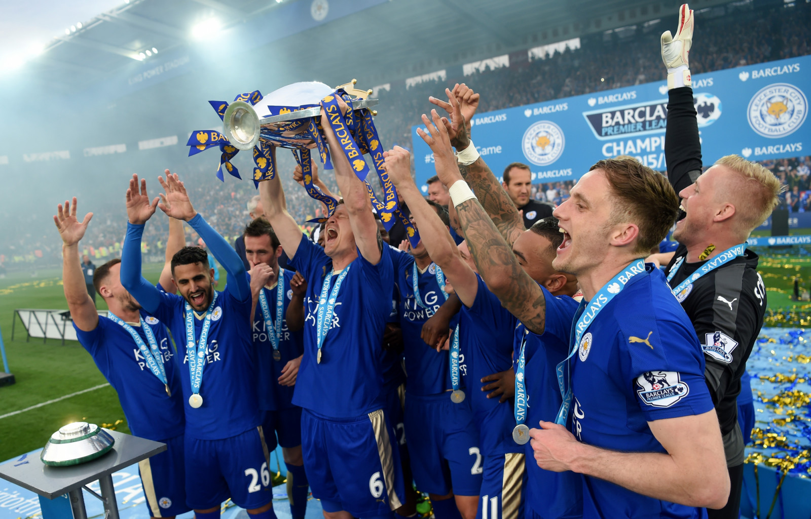 LEICESTER, ENGLAND - MAY 07: Robert Huth of Leicester City lifts the Premier League Trophy as players and staffs celebrate the season champion after the Barclays Premier League match between Leicester City and Everton at The King Power Stadium on May 7, 2016 in Leicester, United Kingdom. (Photo by Michael Regan/Getty Images)