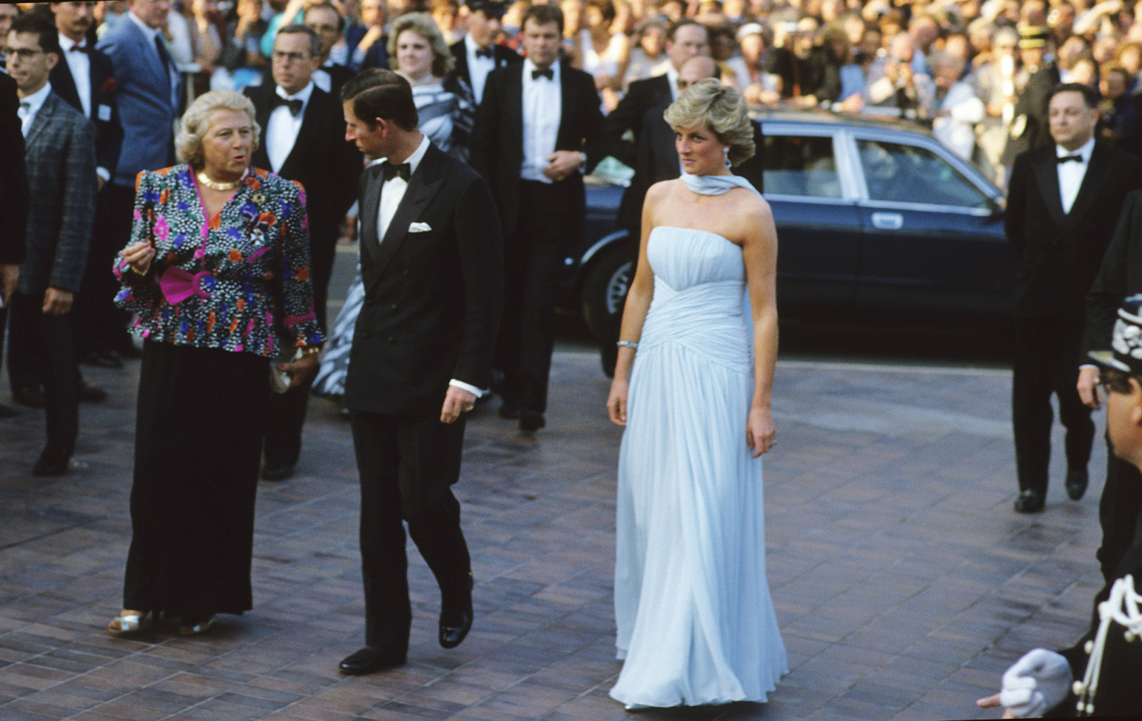 Prince Charles, Prince of Wales and Diana, Princess of Wales, wearing a pale blue silk chiffon strapless dress with a matching chiffon stole designed by Catherine Walker, attend a Gala night in honour of actor Sir Alec Guinness at the Cannes Film Festival on May 15, 1987 (Photo: Anwar Hussein/Getty Images)