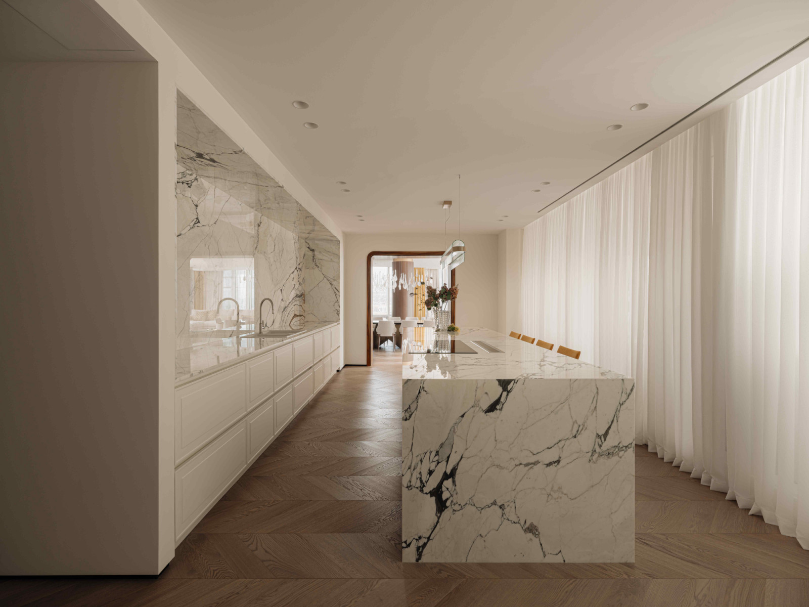 The kitchen with pristine Calacatta Picasso marble on the counter top and backsplash