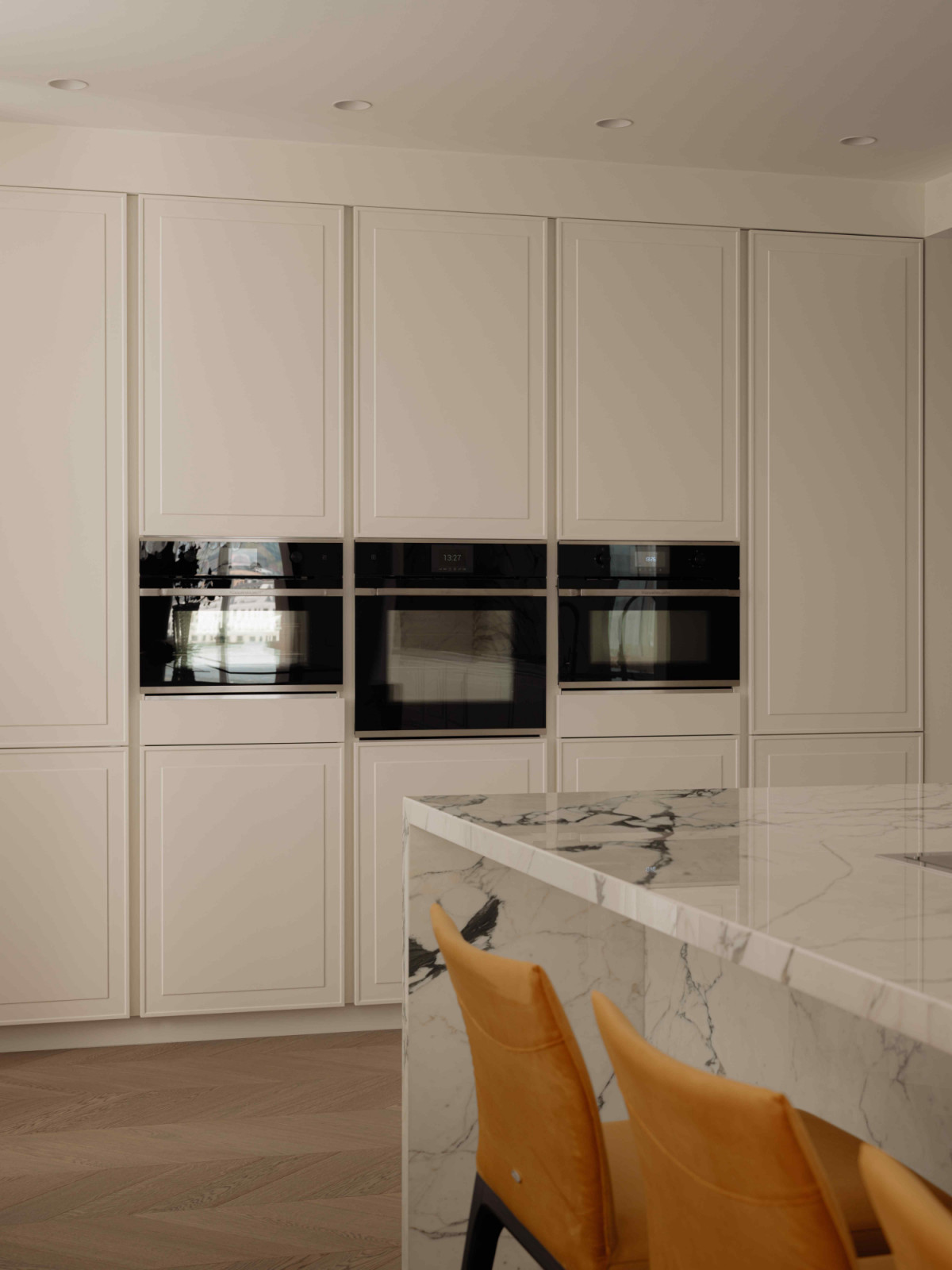 Aster Cucine cabinetry provides sleek and functional storage solutions