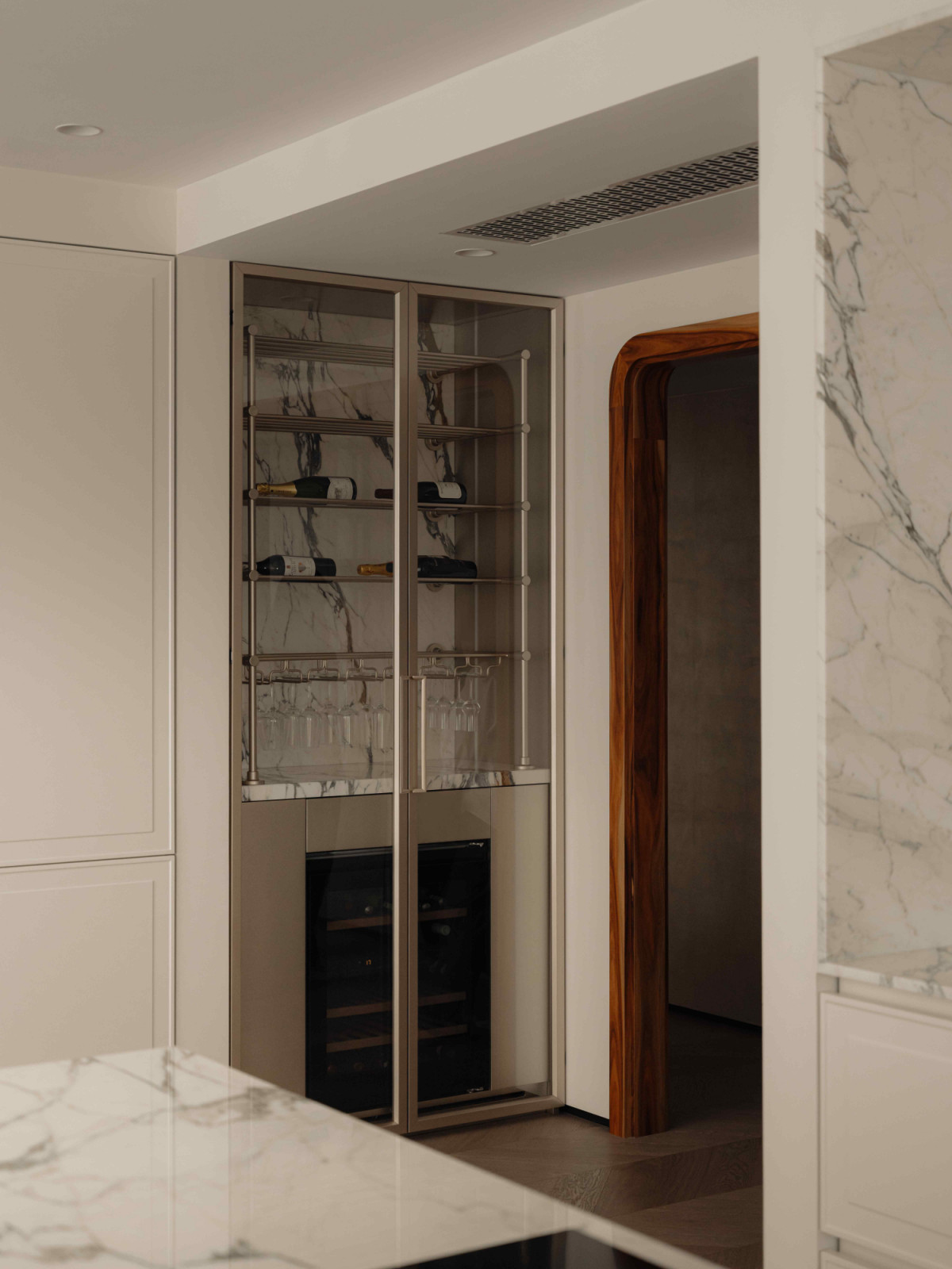 The wine storage by Arnau Group, tucked away to keep the kitchen free from clutter