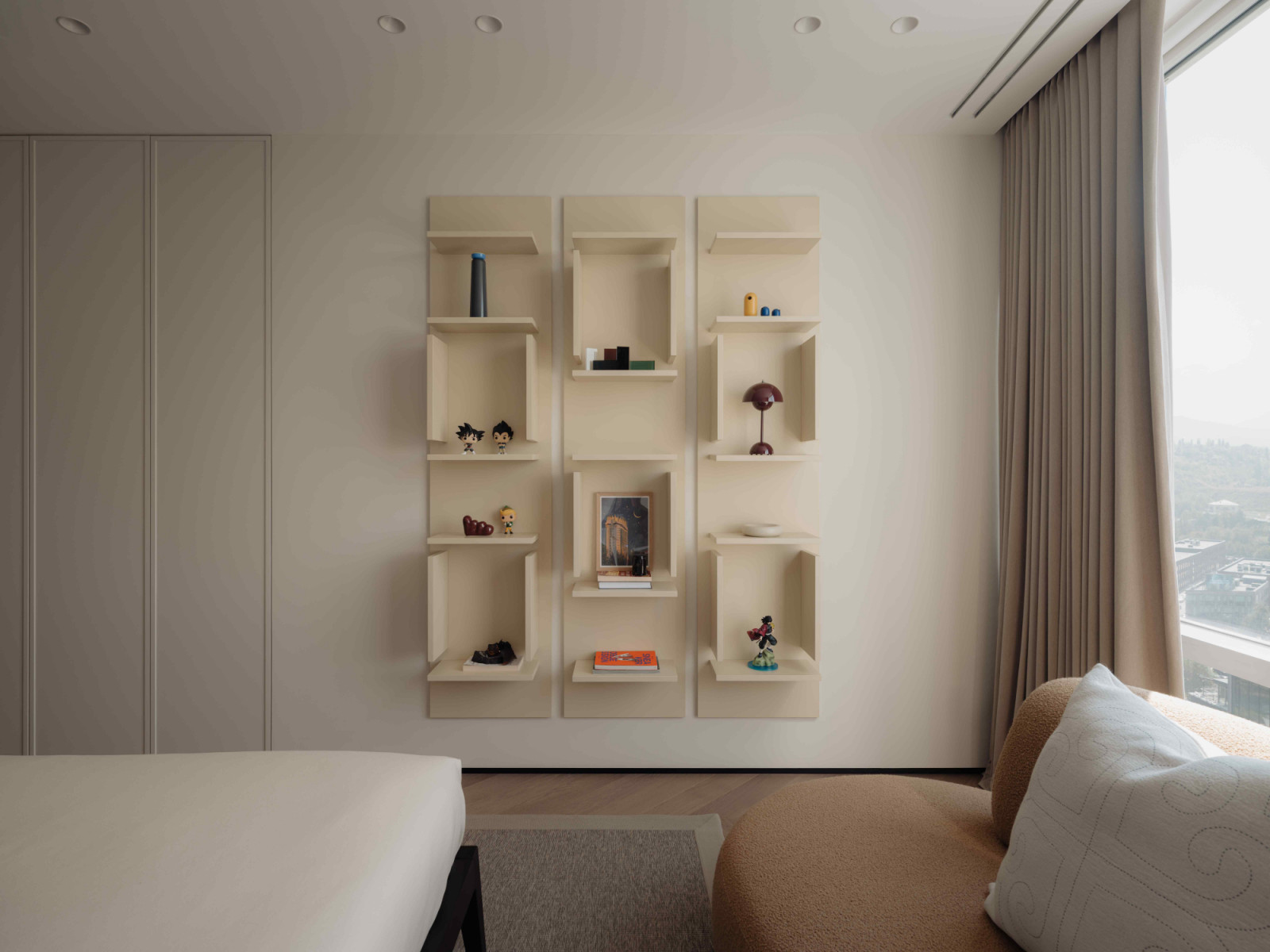The shelving unit offers a tasteful storage space to display favourite items