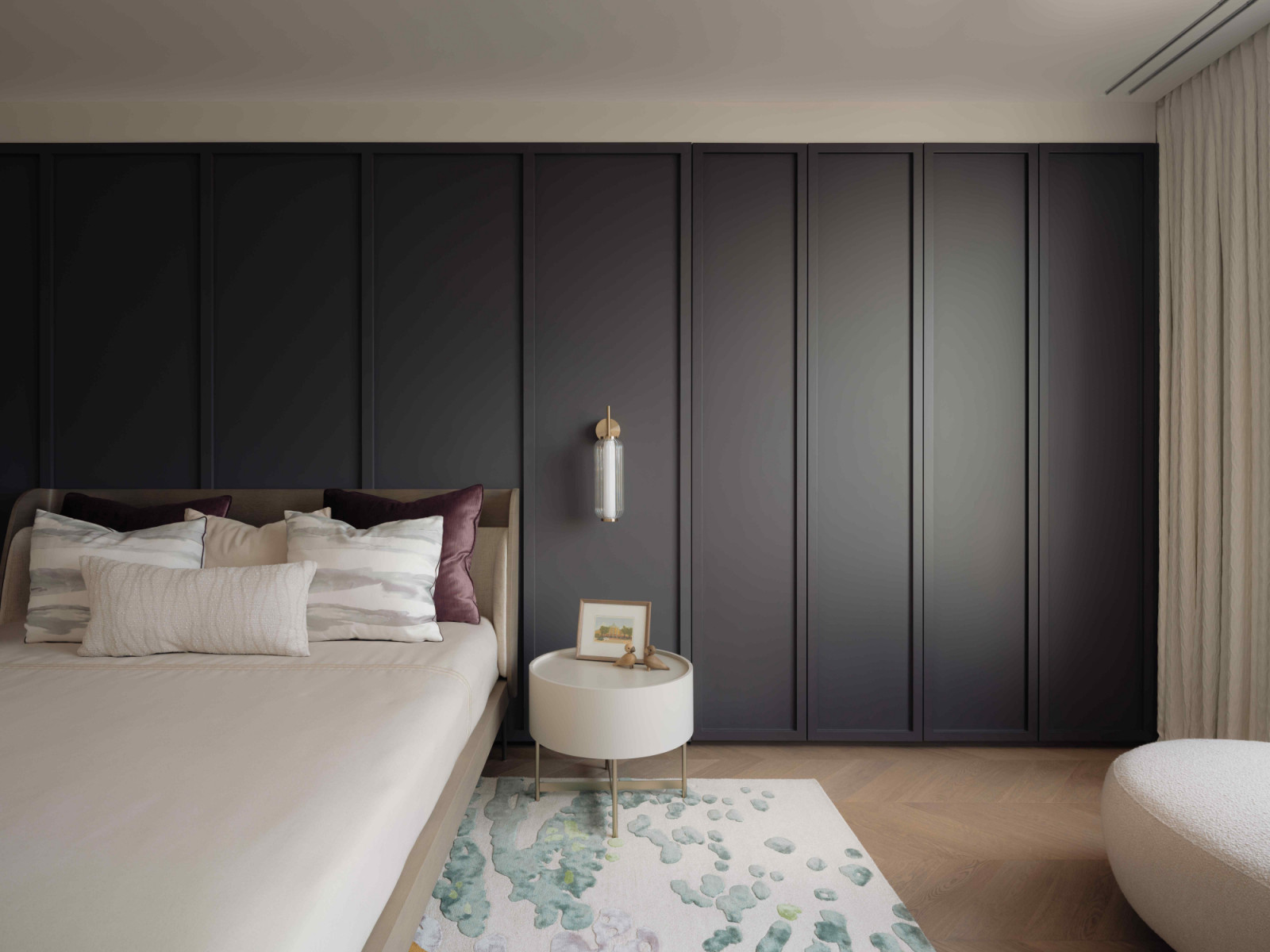 The wardrobe doubles as a panelled wall to keep the room clutter free