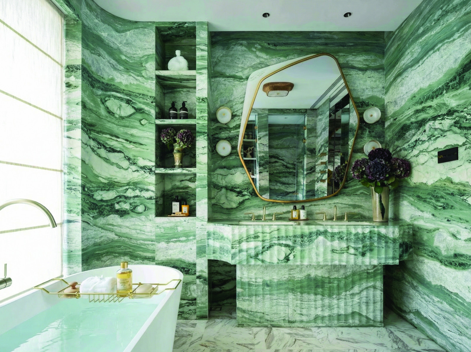 The primary bathroom is enveloped in Appalachian Green marble. (Photo: courtesy of NC Design + Architecture)