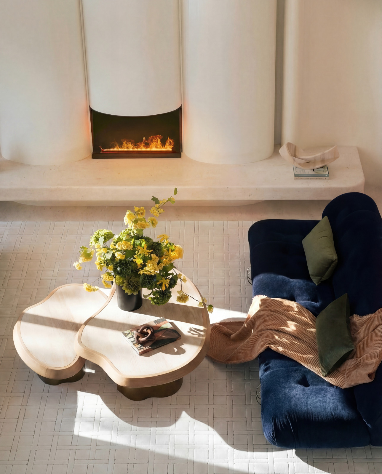 The giant fireplace is remarkably human-scaled. (Photo: courtesy of NC Design + Architecture)