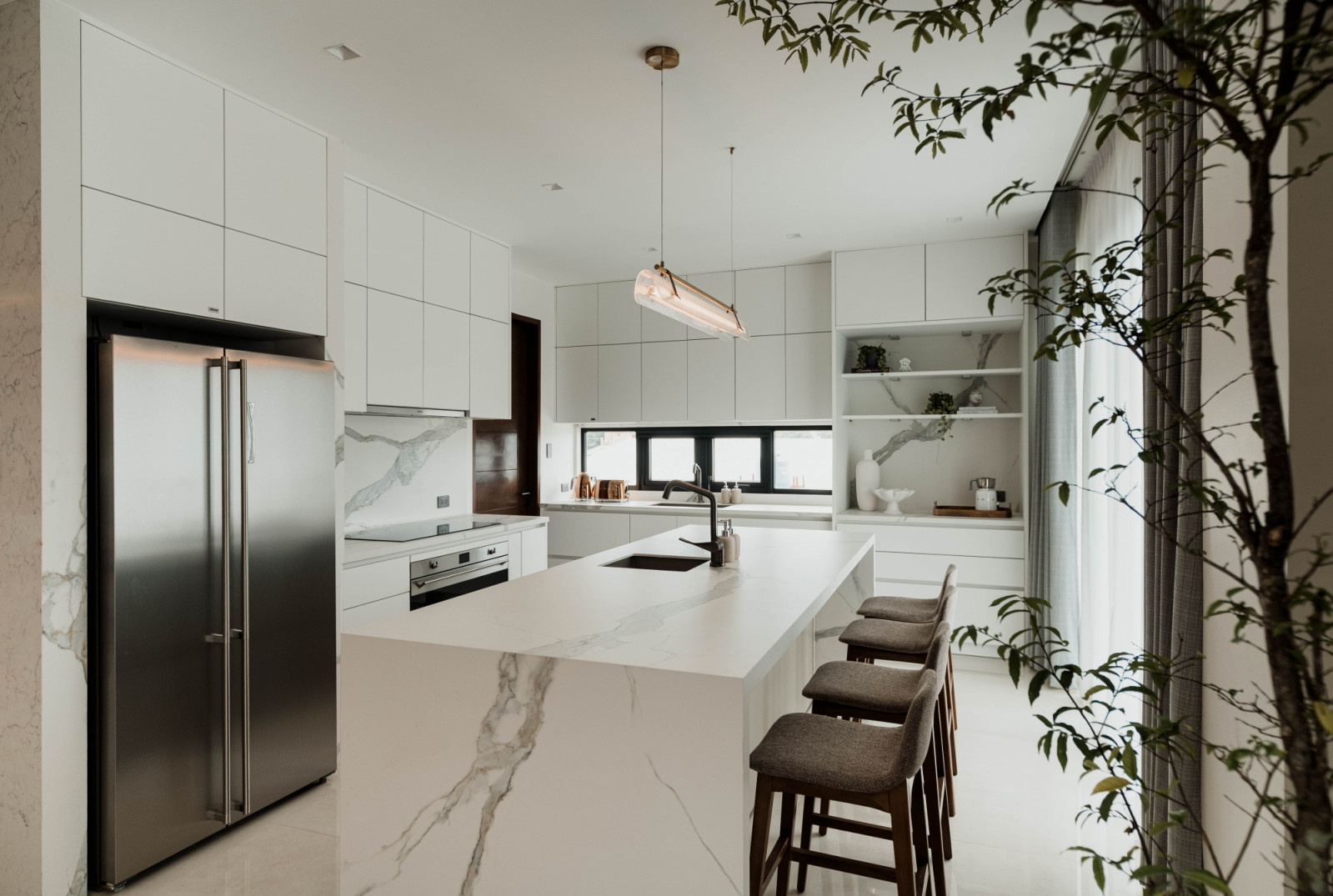 The kitchen in a multigenerational family home in Estancia, Iloilo designed by Isabella Robles-Go of Living Innovations Design Unlimited