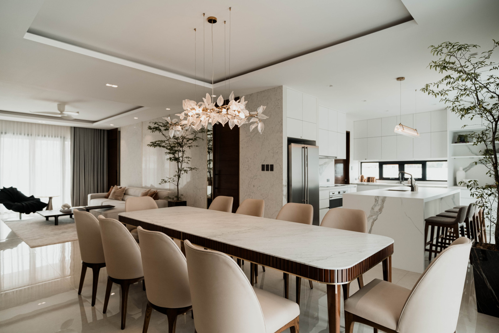 The dining room, living room, and kitchen in a multigenerational family home in Estancia, Iloilo designed by Isabella Robles-Go of Living Innovations Design Unlimited
