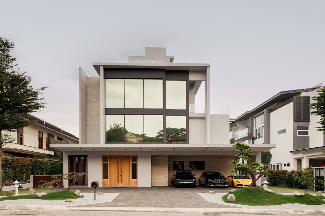 The three-storey facade of JT House, designed by Ong & Ong Architects within the Sierramas Resort Homes enclave north of Kuala Lumpur