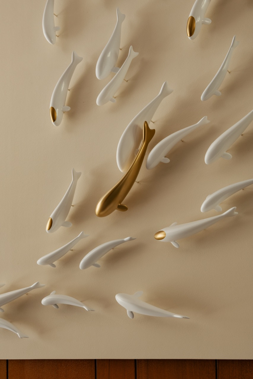 Detail of the three-dimensional fish wall artwork in the family dining area on the ground floor