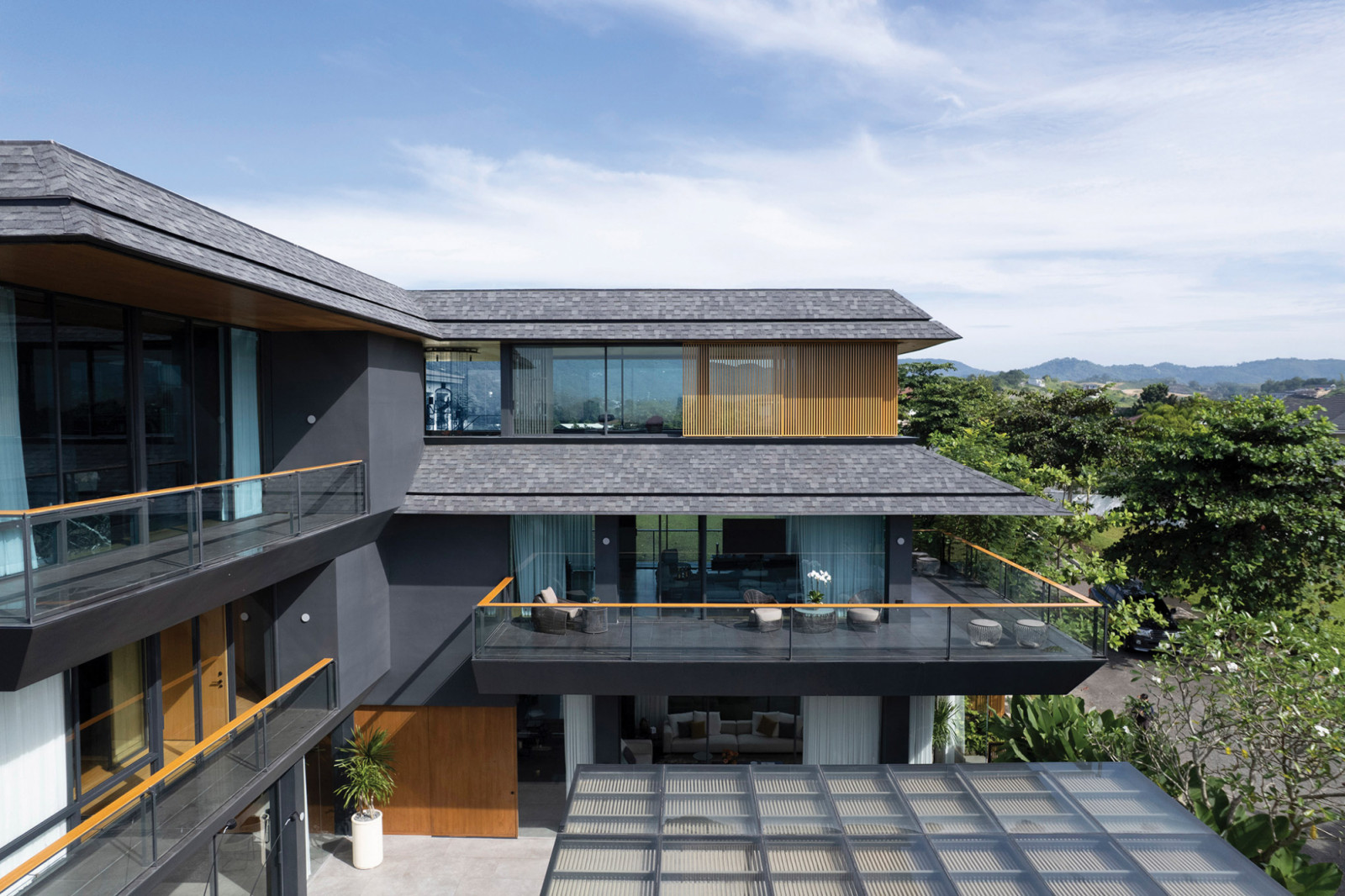 Glass, asphalt shingles, wood, tiles—the short list of materials used on the house