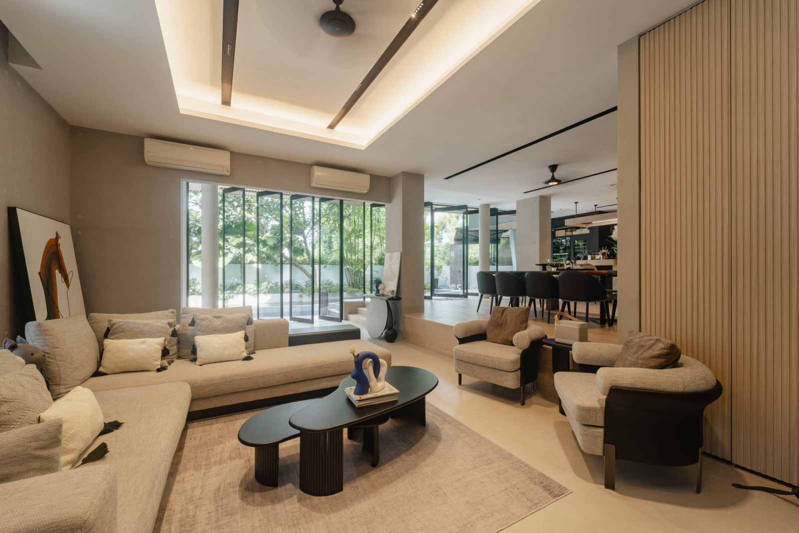 Skylights and tall glazing introduce dynamic natural light and vertical spatial drama