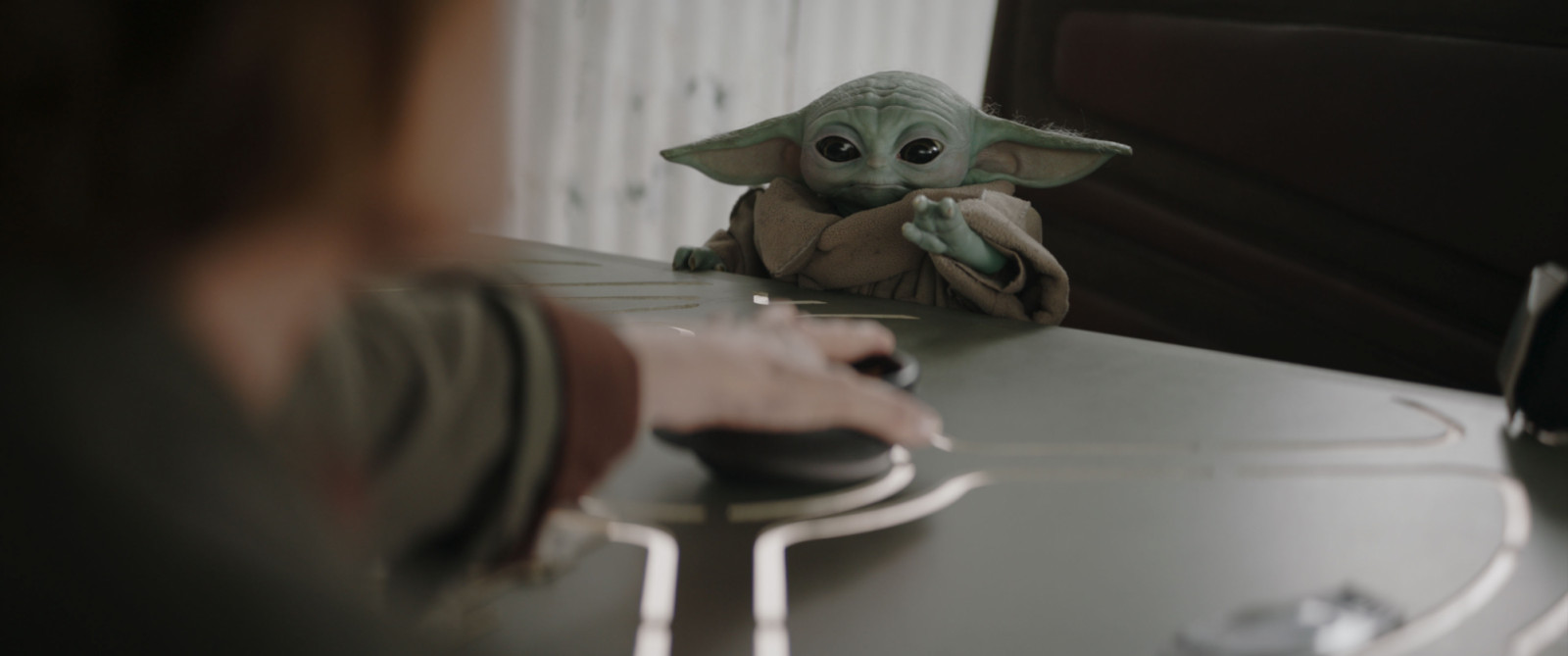 (L-R) Colonel Ward (Sigourney Weaver) and Grogu in Lucasfilm's THE MANDALORIAN & GROGU. Photo courtesy of Lucasfilm. © 2025 Lucasfilm Ltd™. All Rights Reserved.