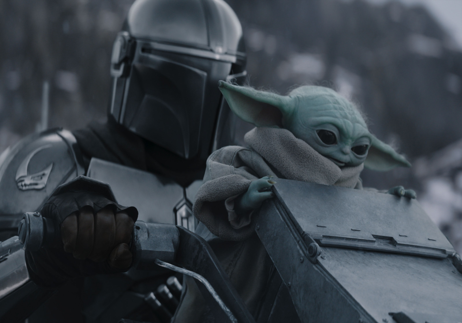 (L-R) The Mandalorian and Grogu in Lucasfilm's THE MANDALORIAN AND GROGU. Photo courtesy of Lucasfilm. © 2026 Lucasfilm Ltd™. All Rights Reserved.