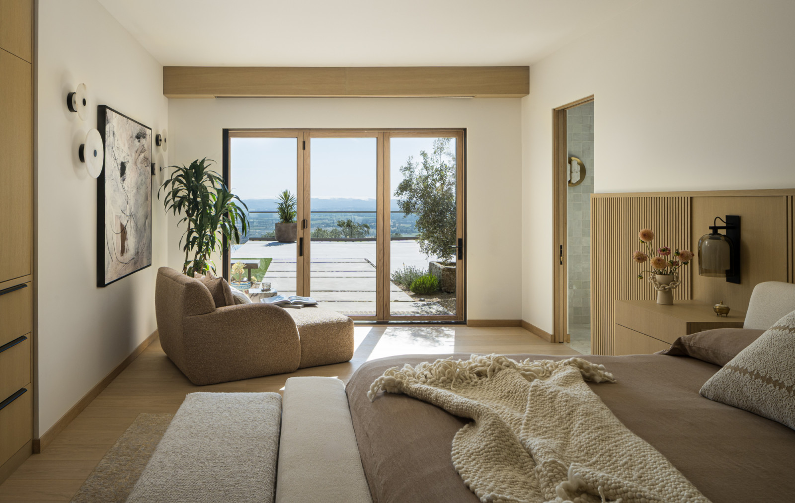 The primary bedroom of a family home designed by Kimberly Oxford Interiors in Santa Rosa, California