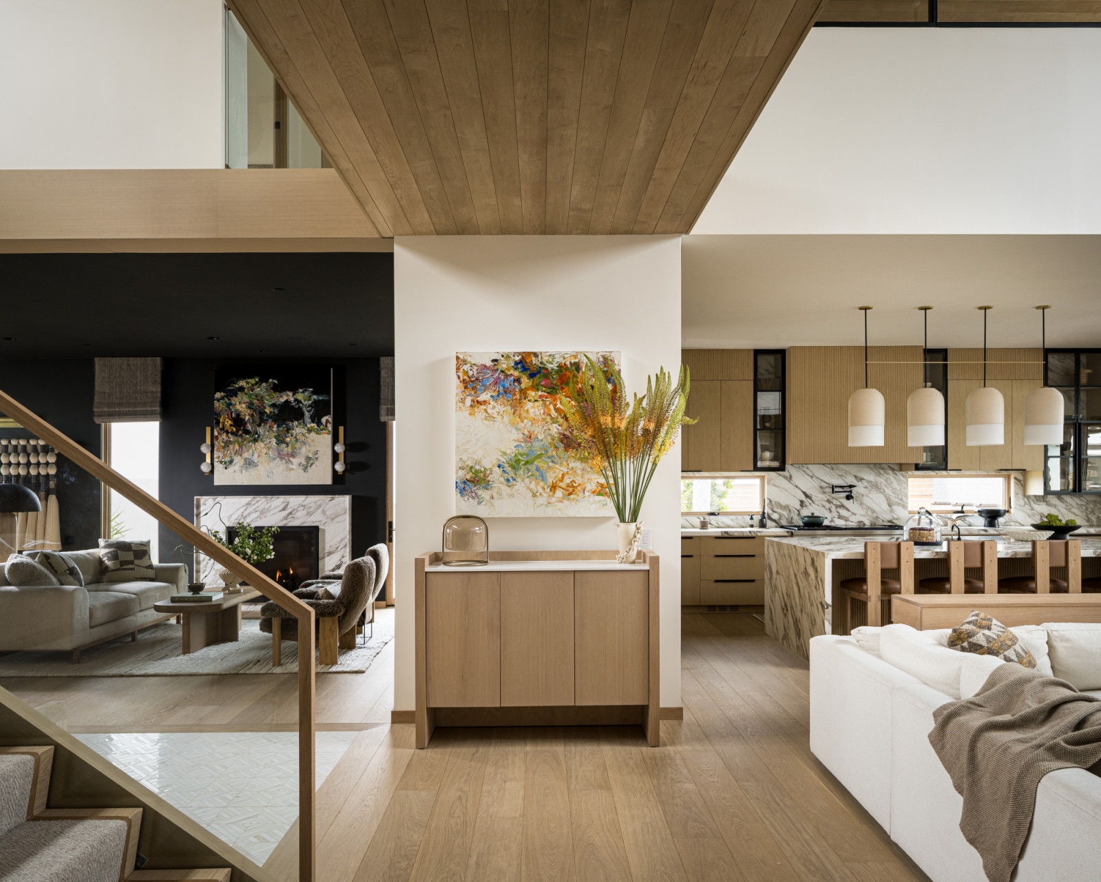 The open floor plan of a dining room, kitchen and living room of a family home designed by Kimberly Oxford Interiors in Santa Rosa, California