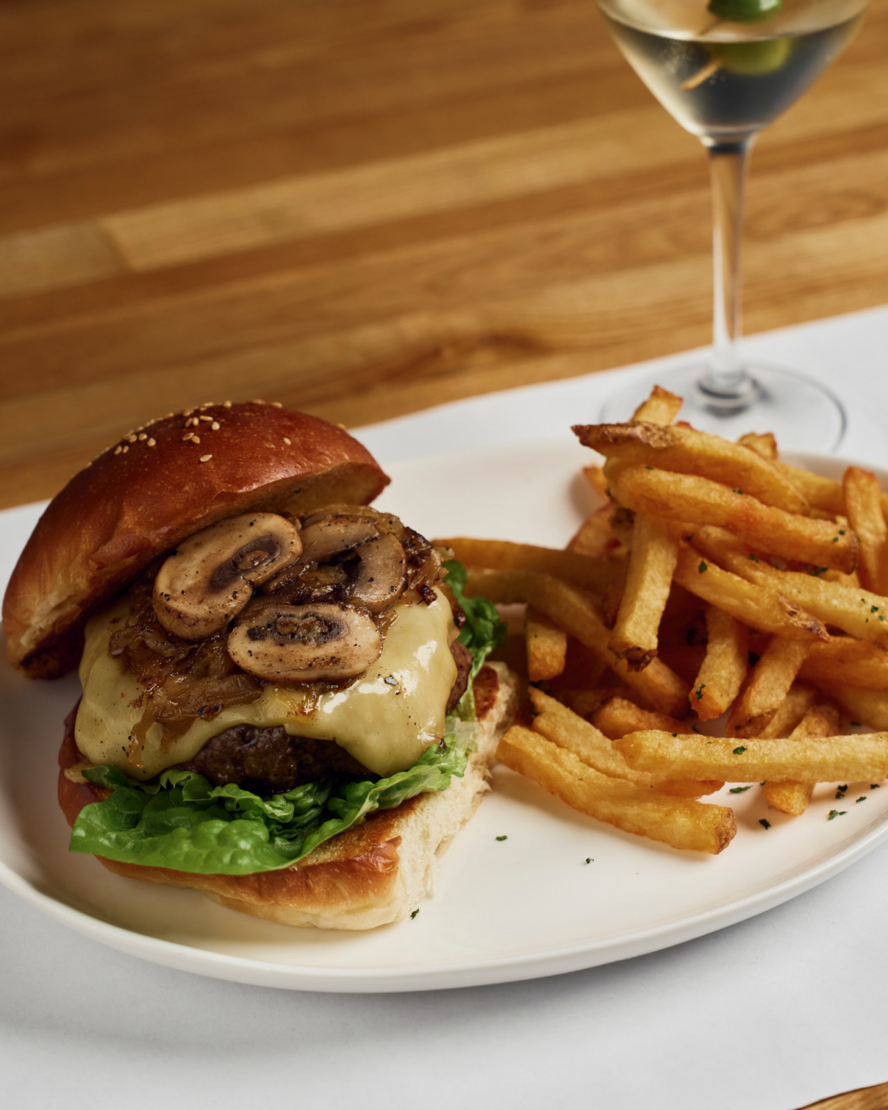 A cheeseburger with a martini at Harry's Bistro