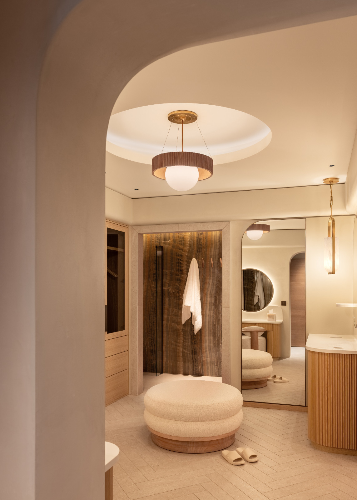 The walk-in closet in a multigenerational family chalet in the Swiss Alps designed by Portia Fox Interiors
