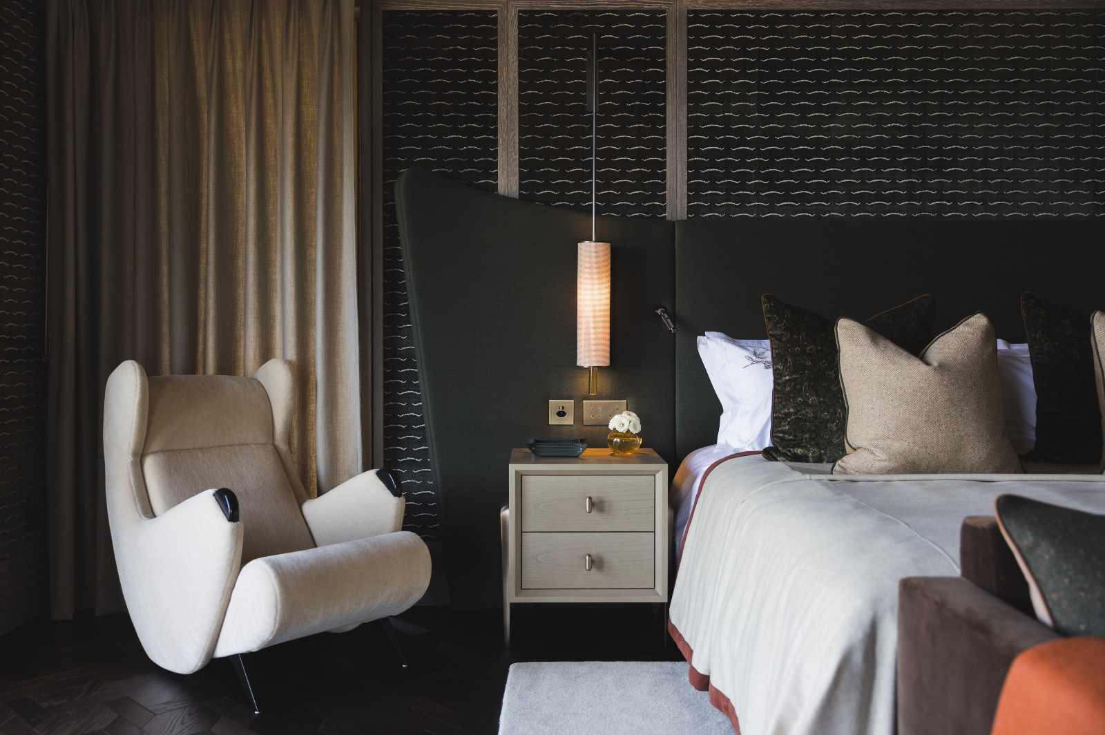 A bedroom in a multigenerational family chalet in the Swiss Alps designed by Portia Fox Interiors
