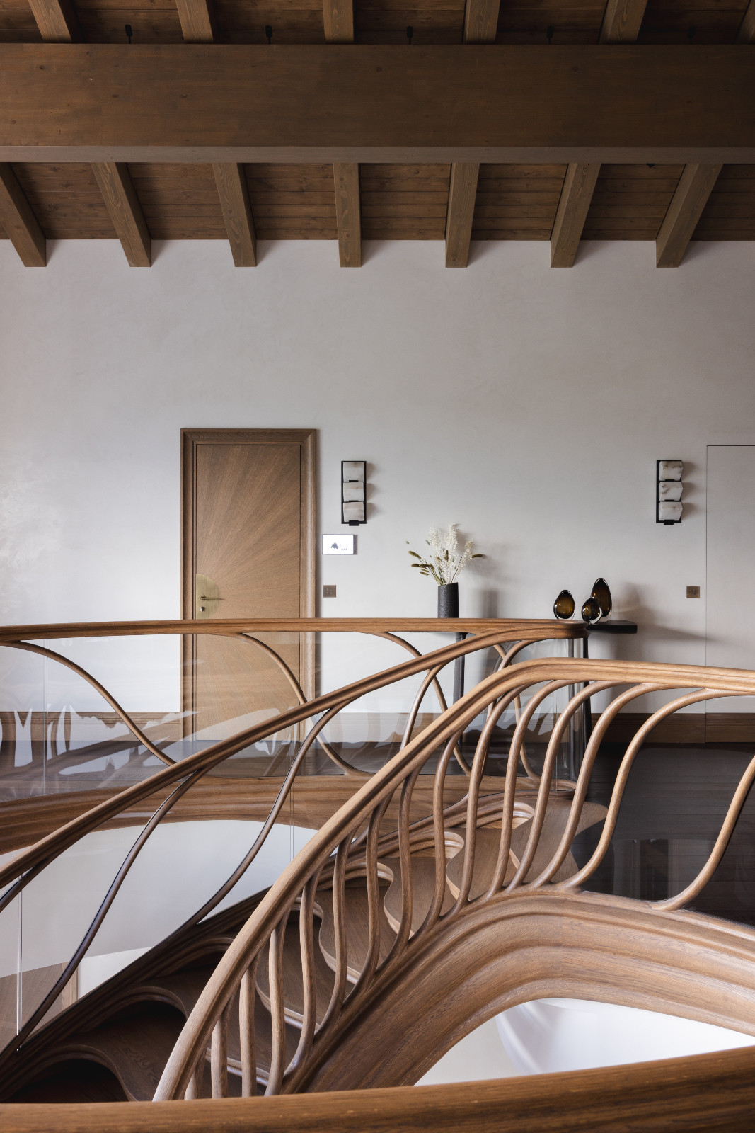 The staircase in a multigenerational family chalet in the Swiss Alps designed by Portia Fox Interiors
