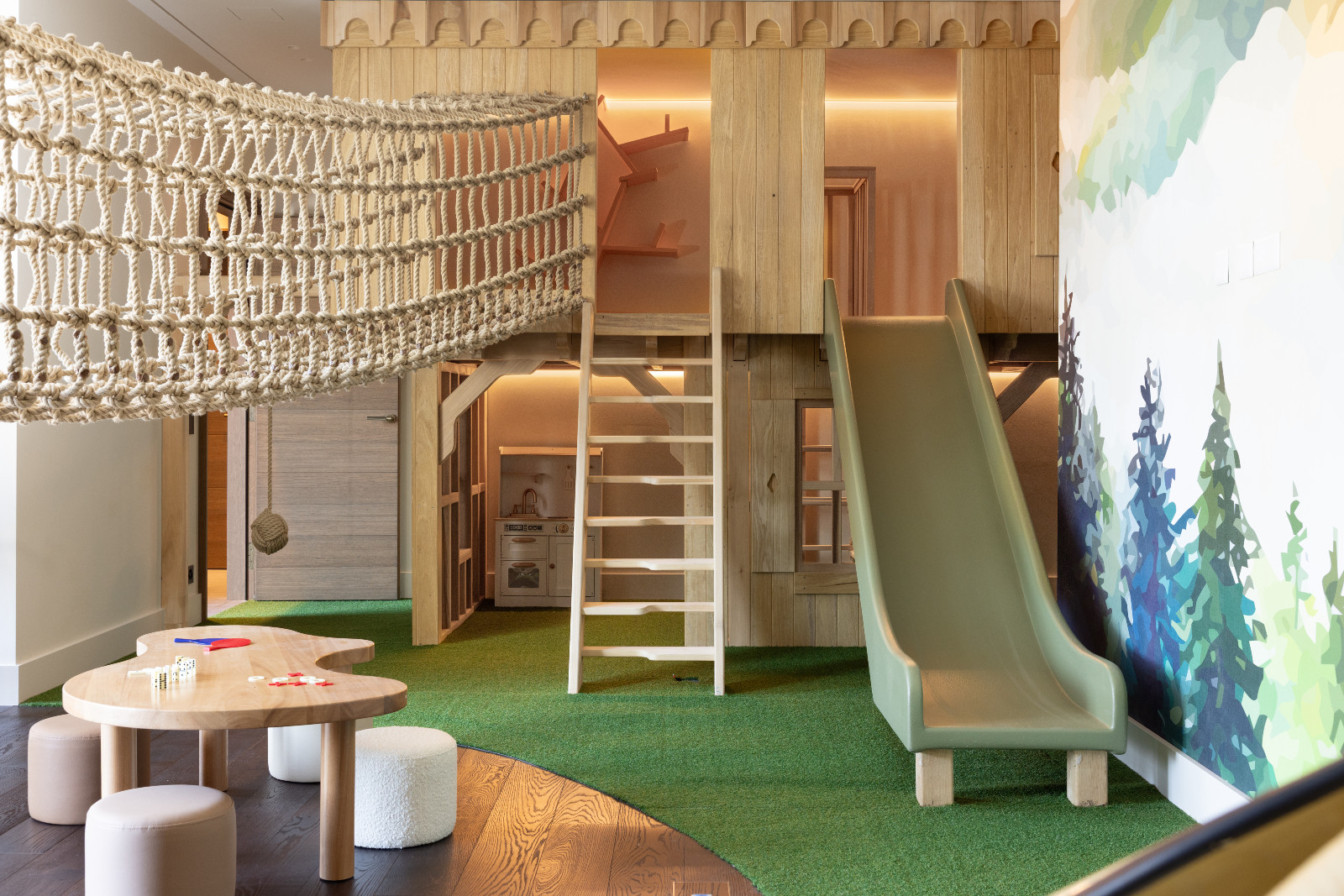 The multi-floor playroom in a multigenerational family chalet in the Swiss Alps designed by Portia Fox Interiors