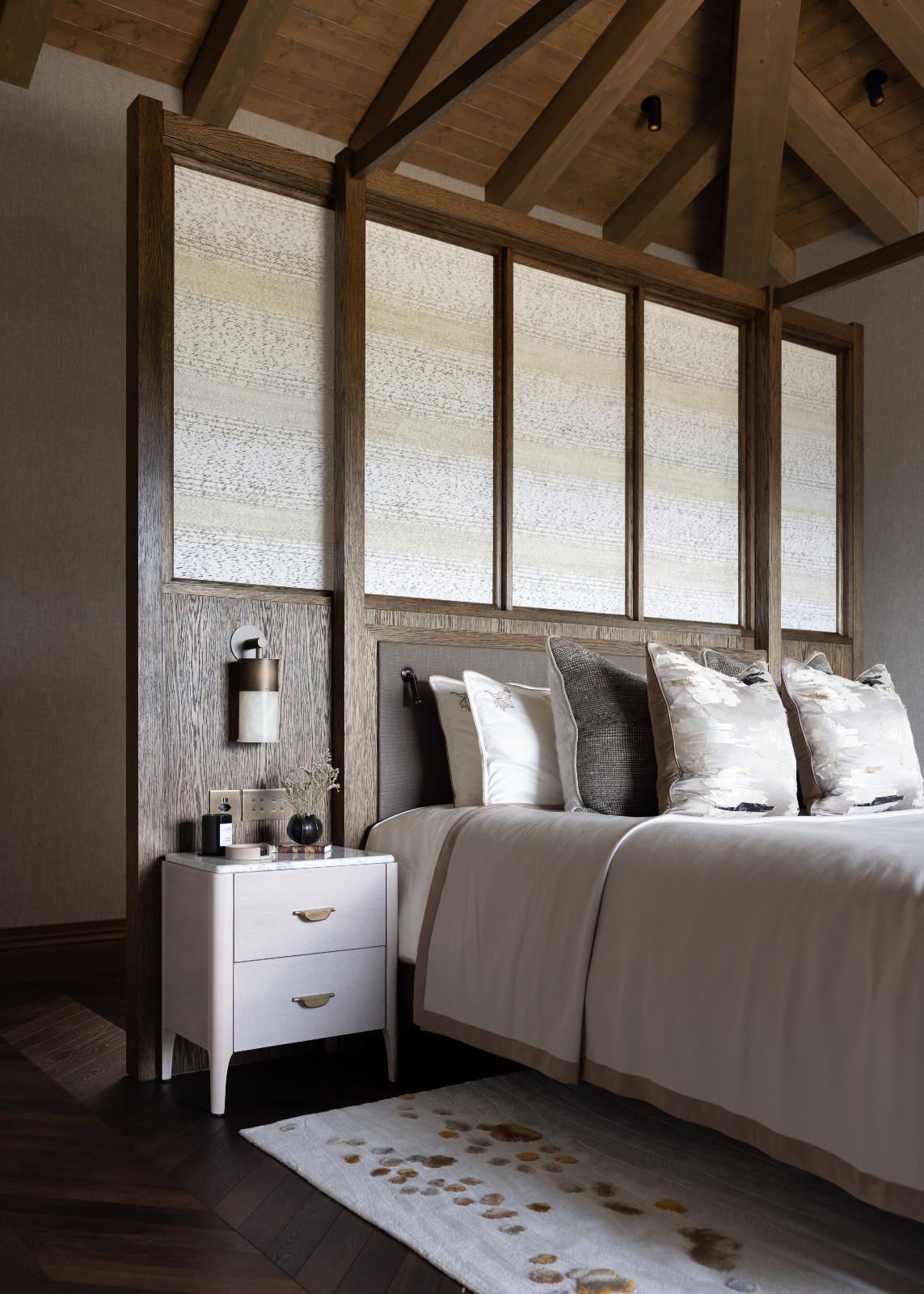 A bedroom in a multigenerational family chalet in the Swiss Alps designed by Portia Fox Interiors