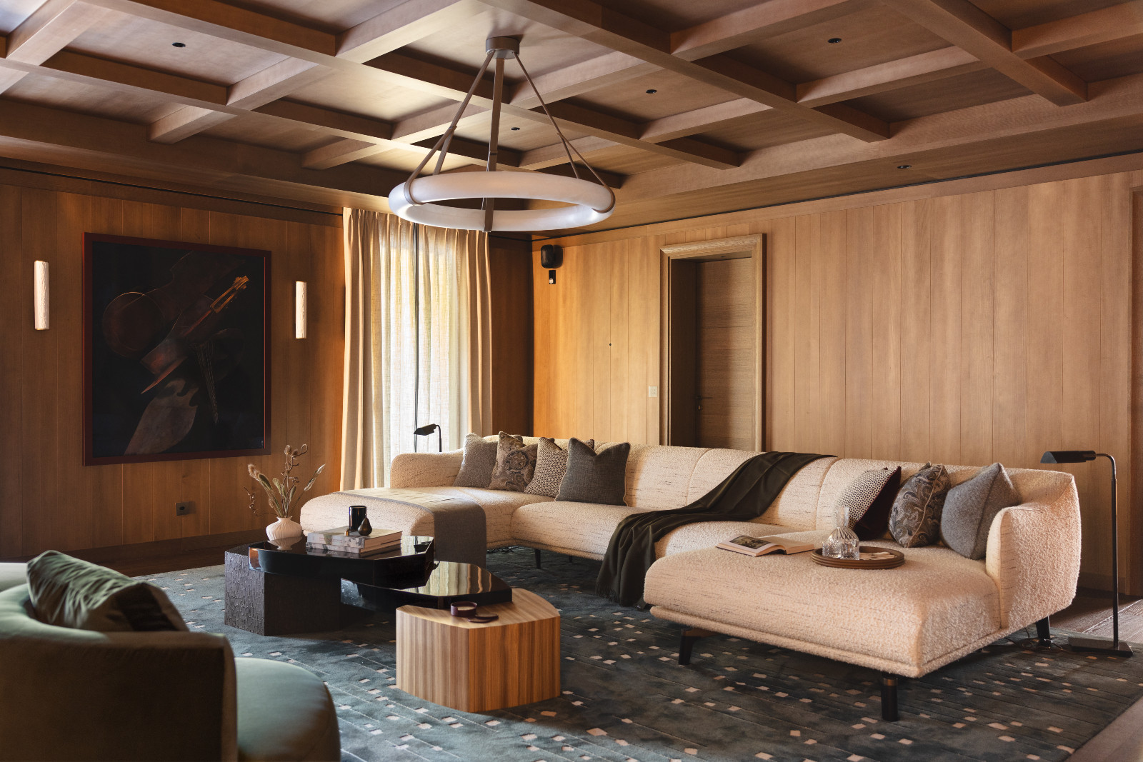 The lounge in a multigenerational family chalet in the Swiss Alps designed by Portia Fox Interiors
