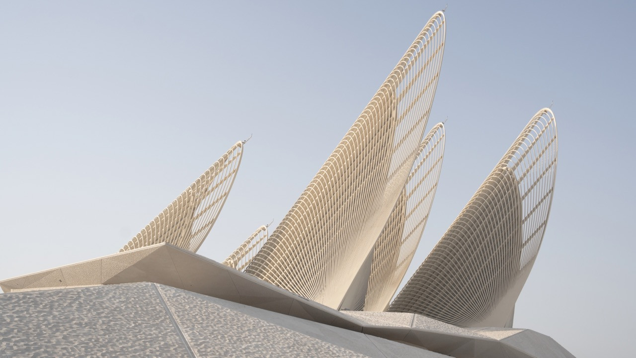 Three of the five steel towers of the Zayed National Museum, their latticed ribs designed to evoke the outstretched wings of a falcon in flight