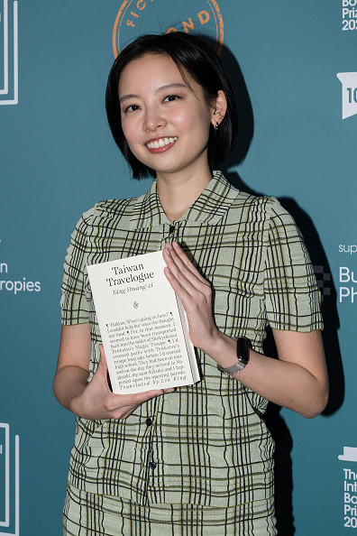 LONDON, UNITED KINGDOM - MAY 19: Translator Lin King poses with the book titled âTaiwan Travelogueâ during the official winnersâ ceremony of the International Booker Prize 2026 at Tate Modern in London, United Kingdom on May 19, 2026. The International Booker Prize is awarded annually for the finest single work of fiction from around the world which has been translated into English and published in the UK and Ireland. (Photo by Wiktor Szymanowicz/Anadolu via Getty Images)