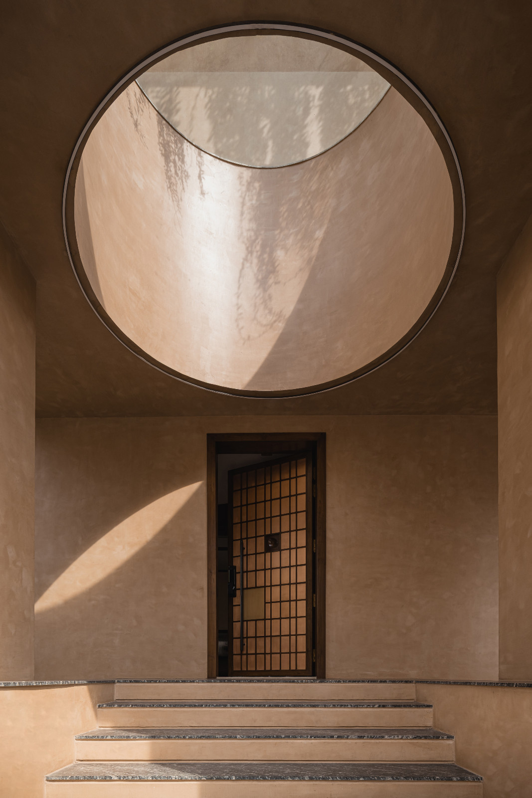 The entryway of a Navsari, India family home designed by Veeram Shah of Design Ni Dukaan