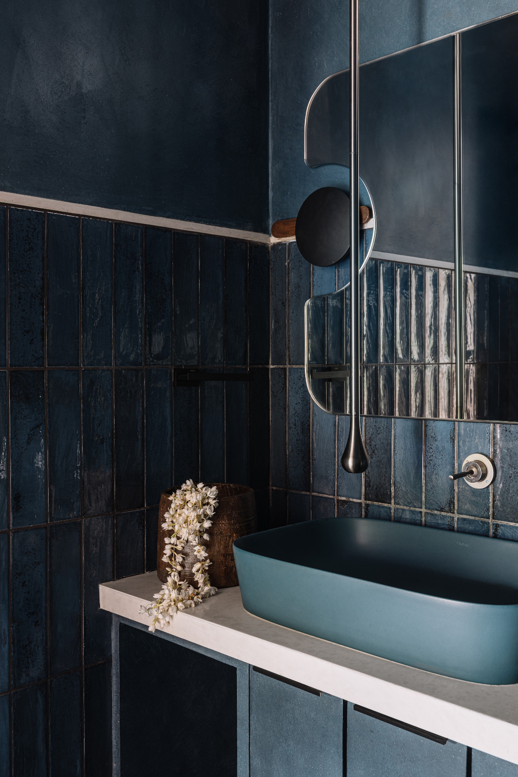 The powder room in a Navsari, India family home designed by Veeram Shah of Design Ni Dukaan