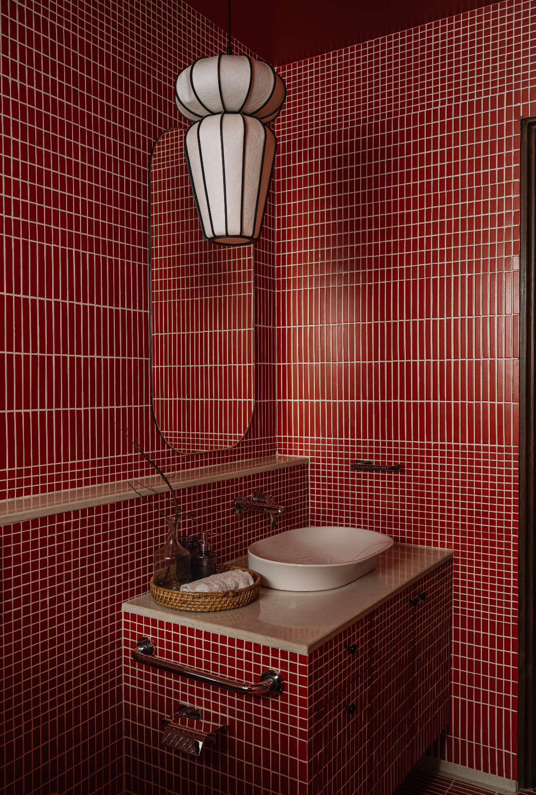 The guest bathroom in a Navsari, India family home designed by Veeram Shah of Design Ni Dukaan