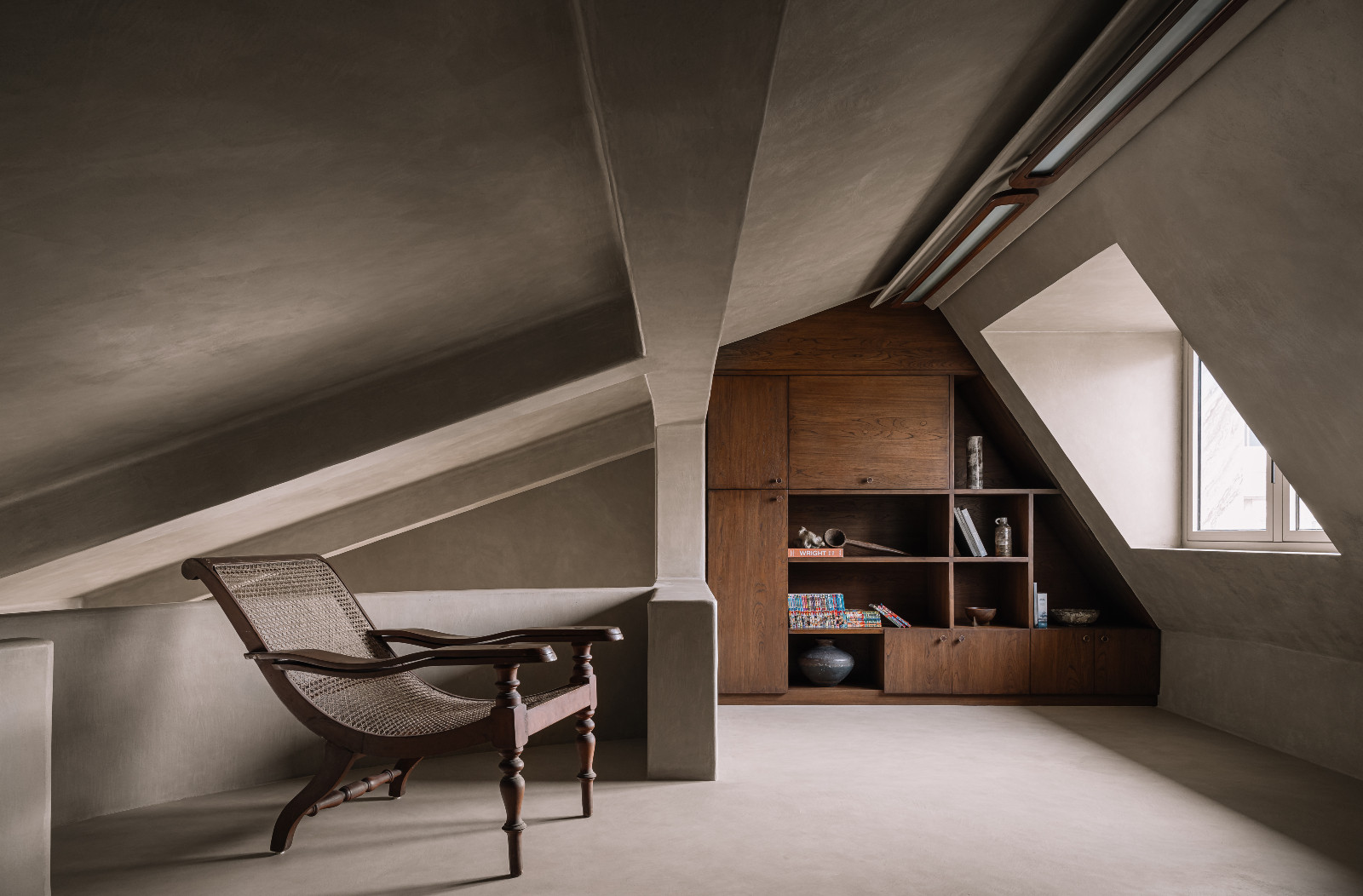 The lounge celebrating materiality and architectural forms in a Navsari, India family home designed by Veeram Shah of Design Ni Dukaan