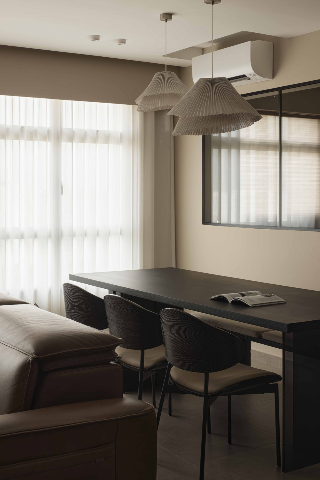 Limewashed walls contrast against the darker fixtures, lightening the tonal palette to retain balance