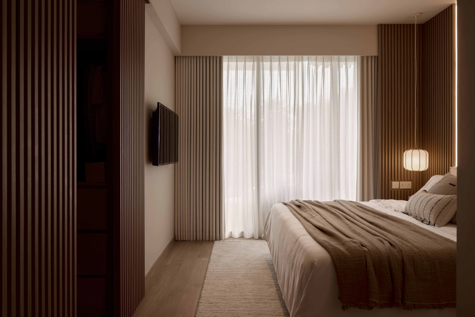 The soft, comforting energy in the bedroom helps the homeowners slow down and unwind