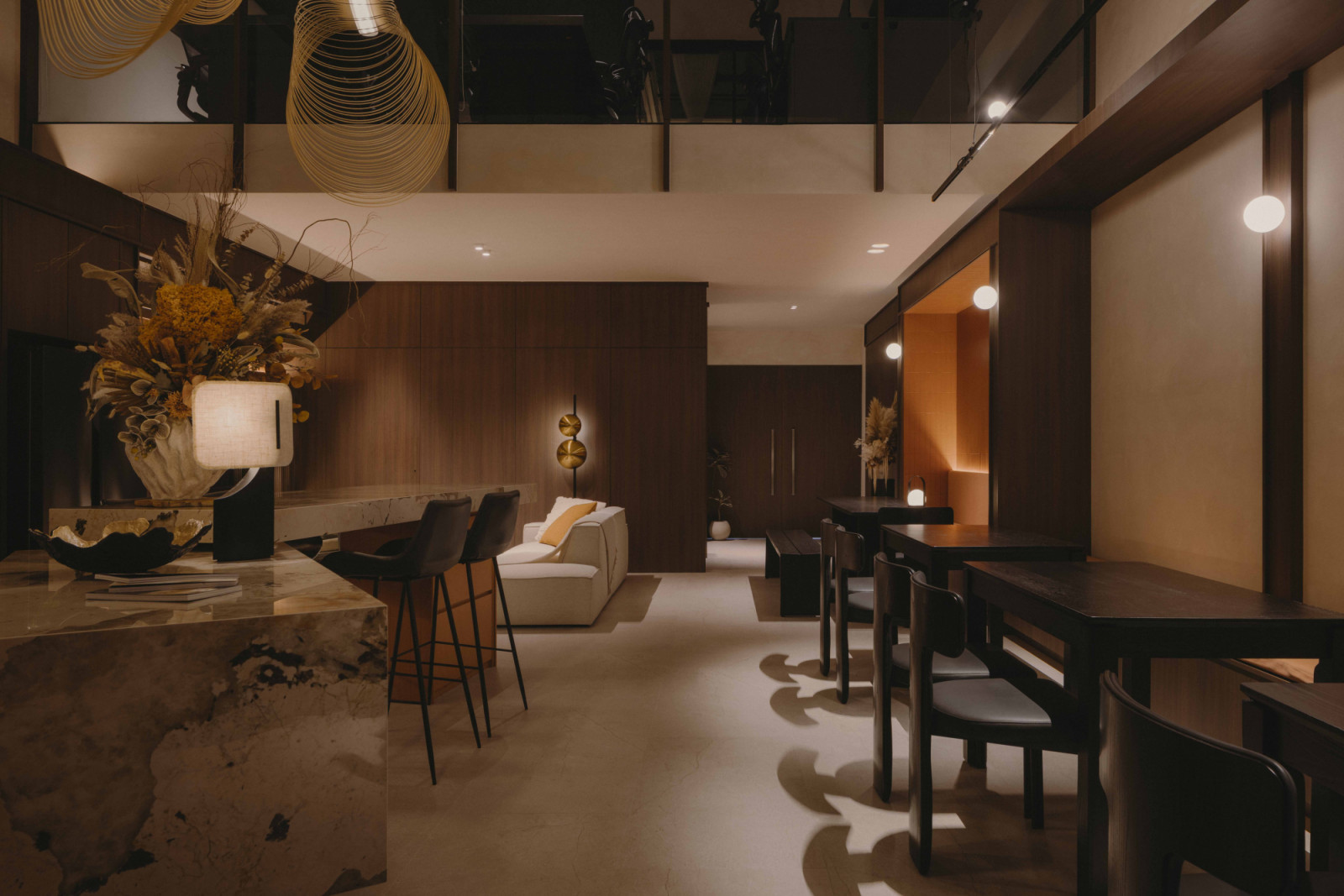 The studio’s core is a mezzanine anchored by a diagonally positioned Patagonia stone island