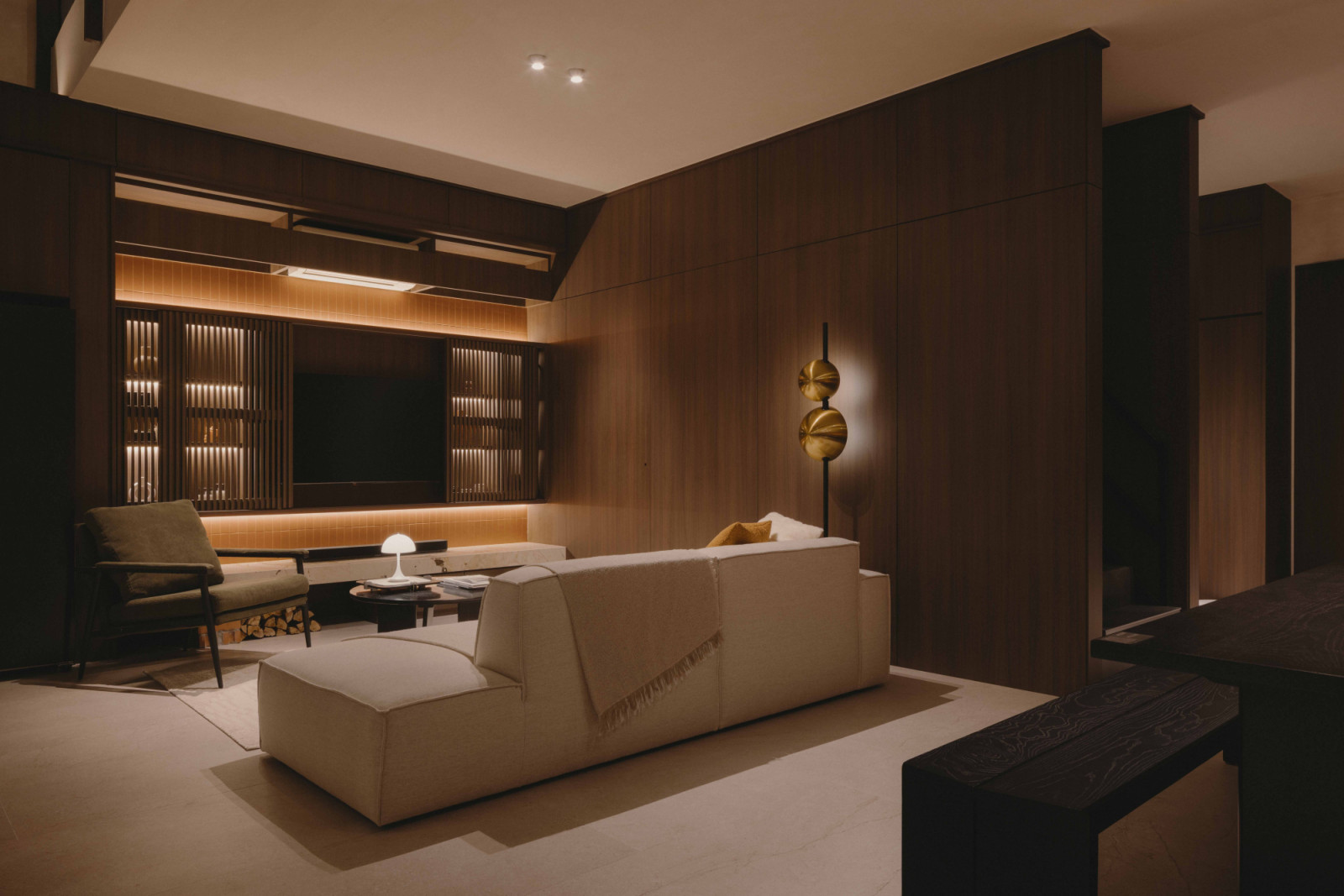 The lounge offers quietude in hushed tones and natural textures, a space for pause between conversations
