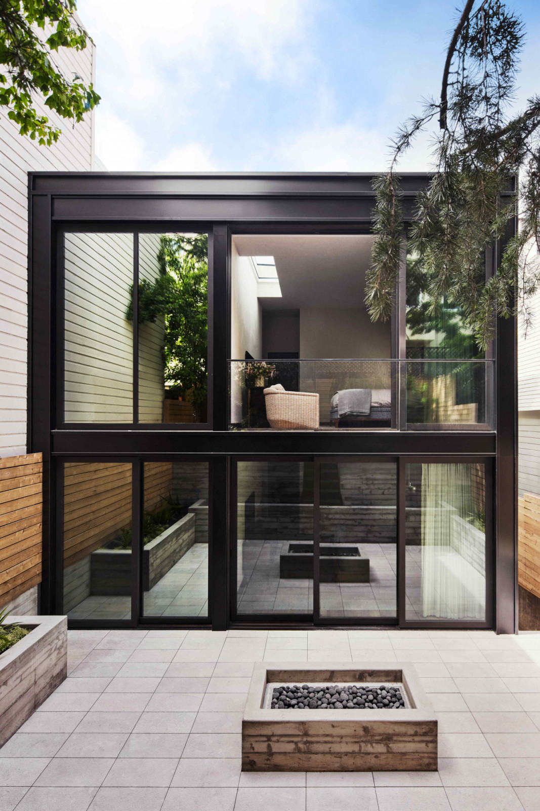 The rear façade was rebuilt to accommodate expansive windows and sliding glass doors