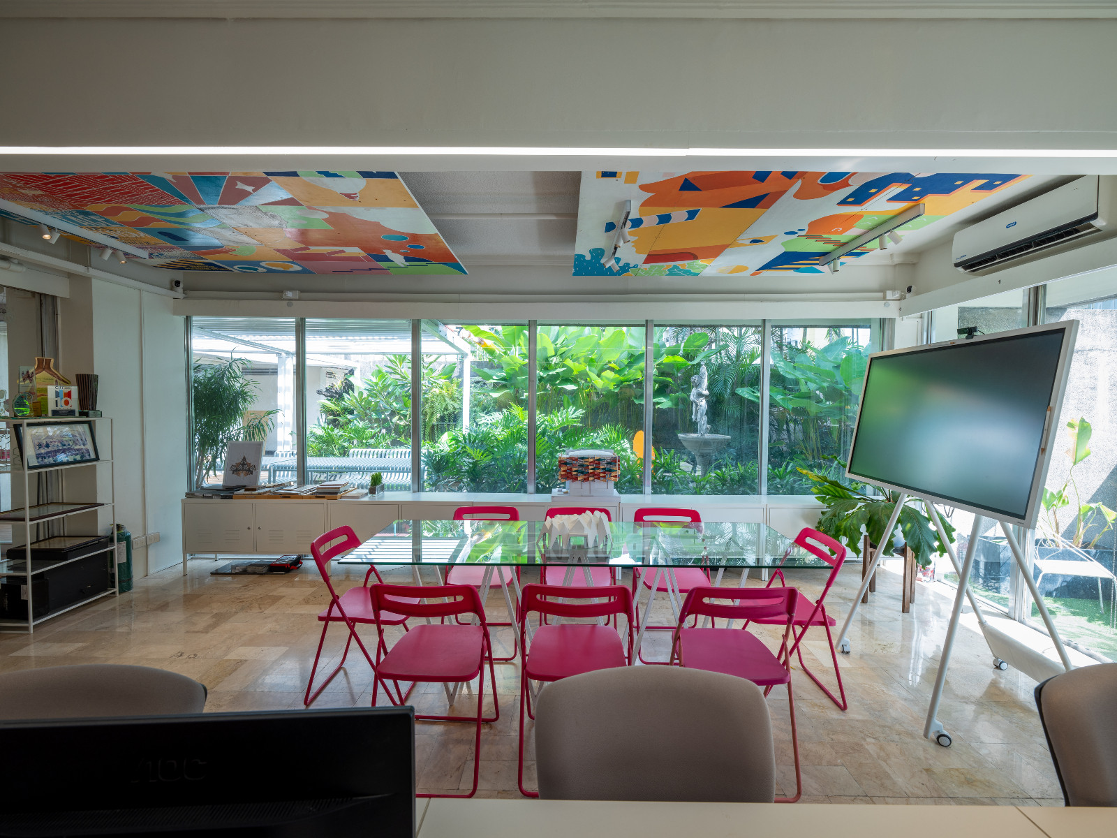 Bright pops of colour and natural light filter through the brainstorming area of the Barchan + Architecture office in Manila, Philippines