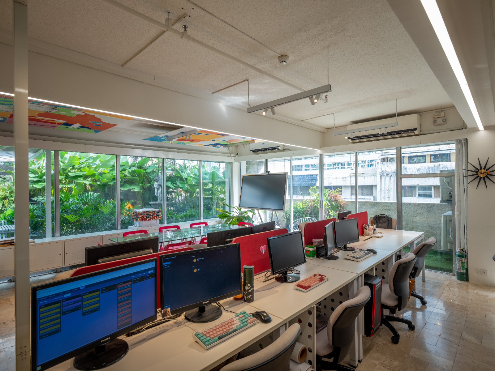 Bright pops of colour and natural light filter through the brainstorming area of the Barchan + Architecture office in Manila, Philippines