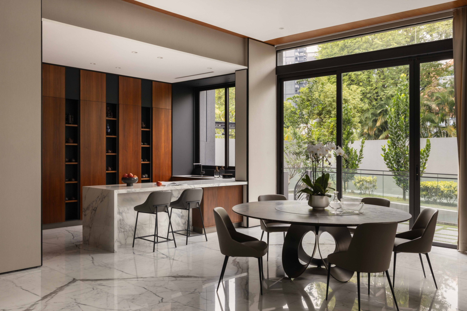 In the dining area, the Arketipo Oracle Dining Table anchors the room with sculptural presence