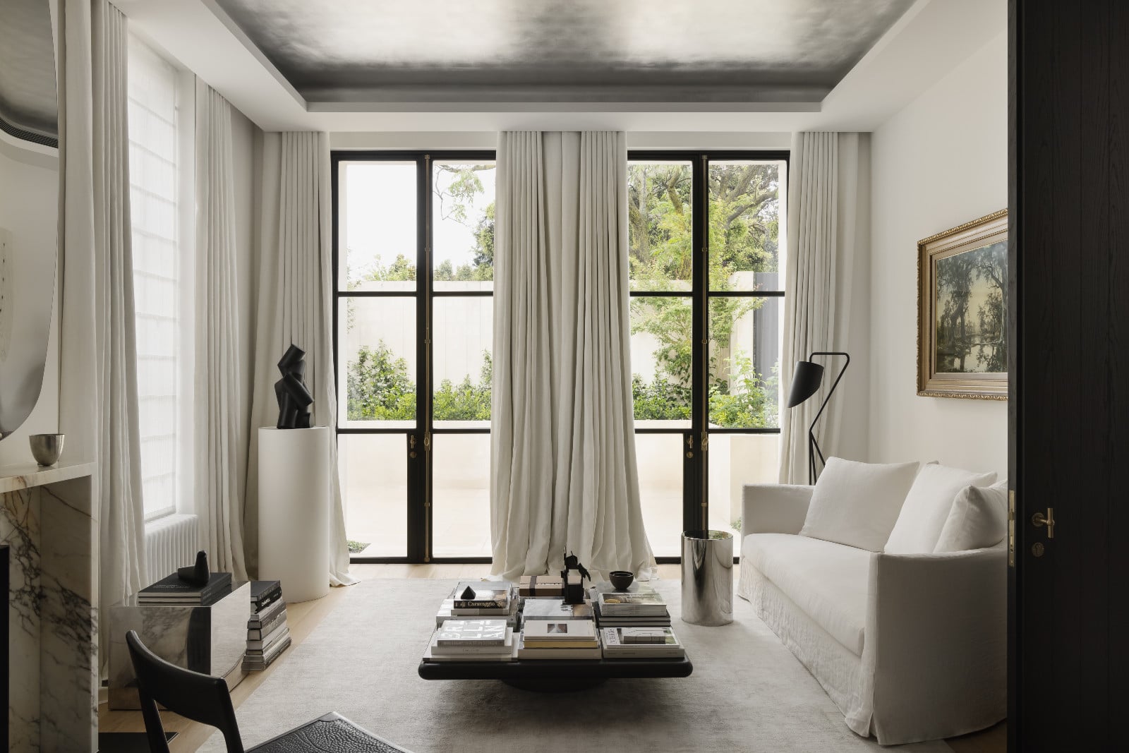 Glimpses of greenery from the living room of architect Paul Conrad's home in the suburbs of Melbourne, Australia
