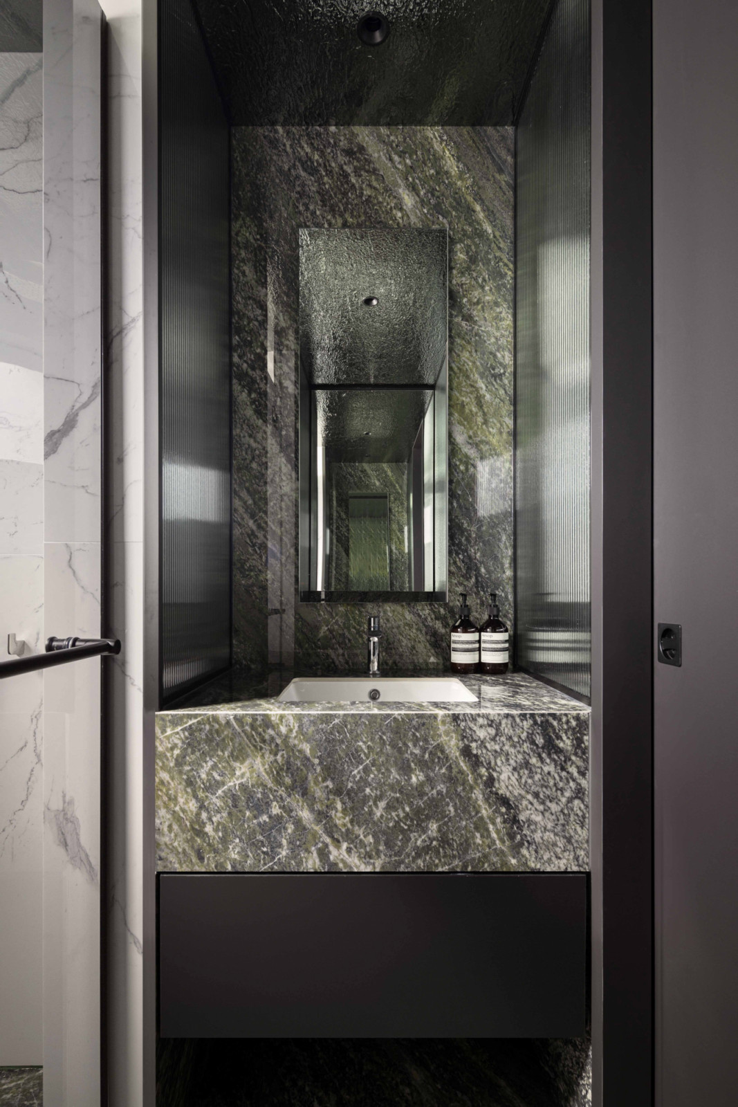 Green tones make a statement in this bathroom