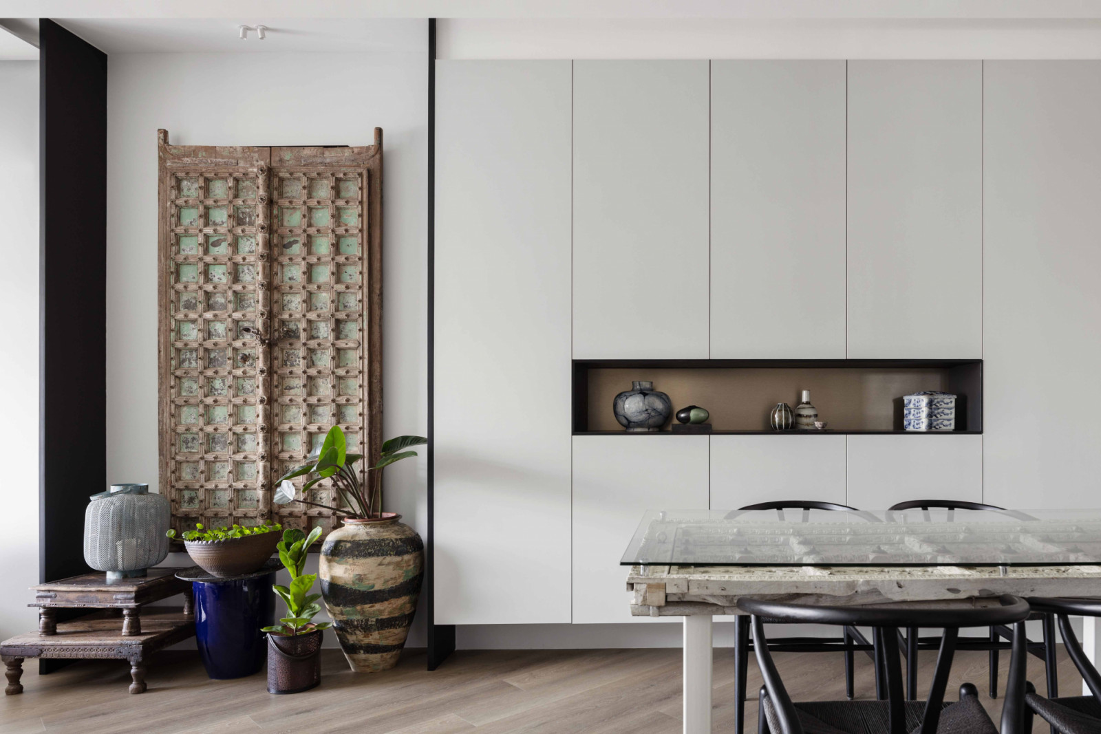 An antique screen was mounted as an art piece within an alcove, transforming it from a functional object into a focal point