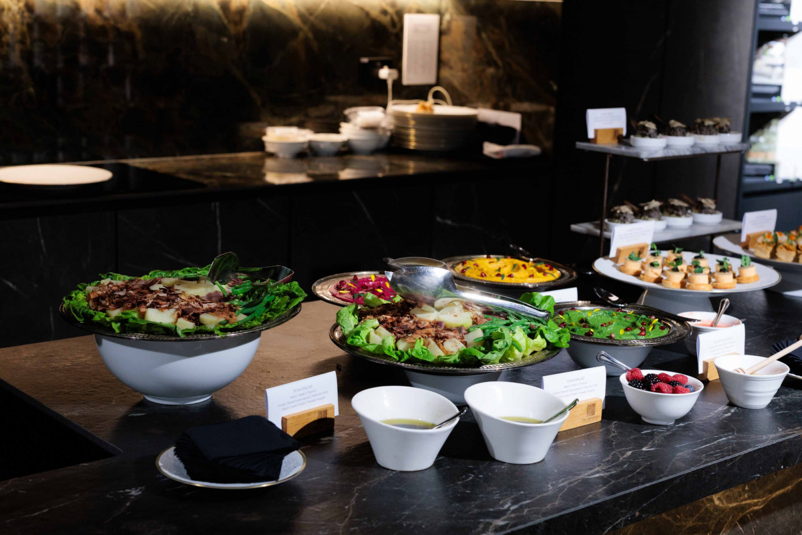 A glimpse of the grazing table, artfully composed within the showroom's Stone Gallery kitchen