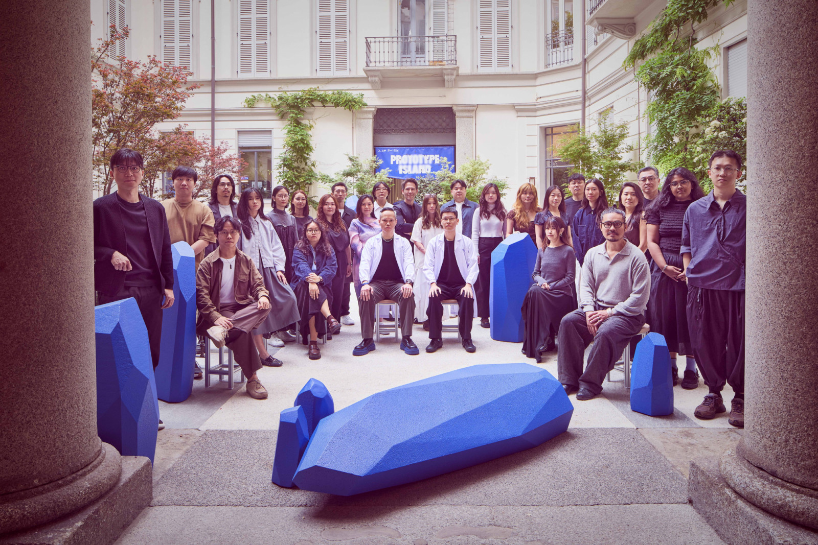 The participating designers and curators on site during the Milan Design Week 2026