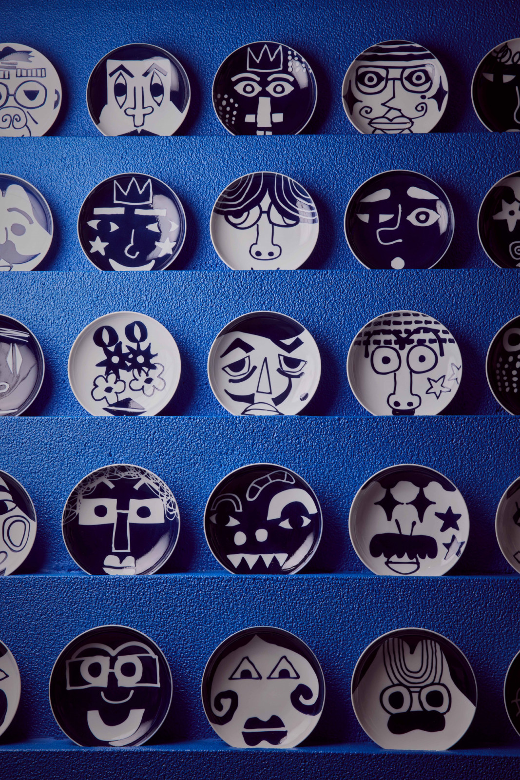 People of the World: 25 cobalt blue and white porcelain plates co-designed with persons with disabilities